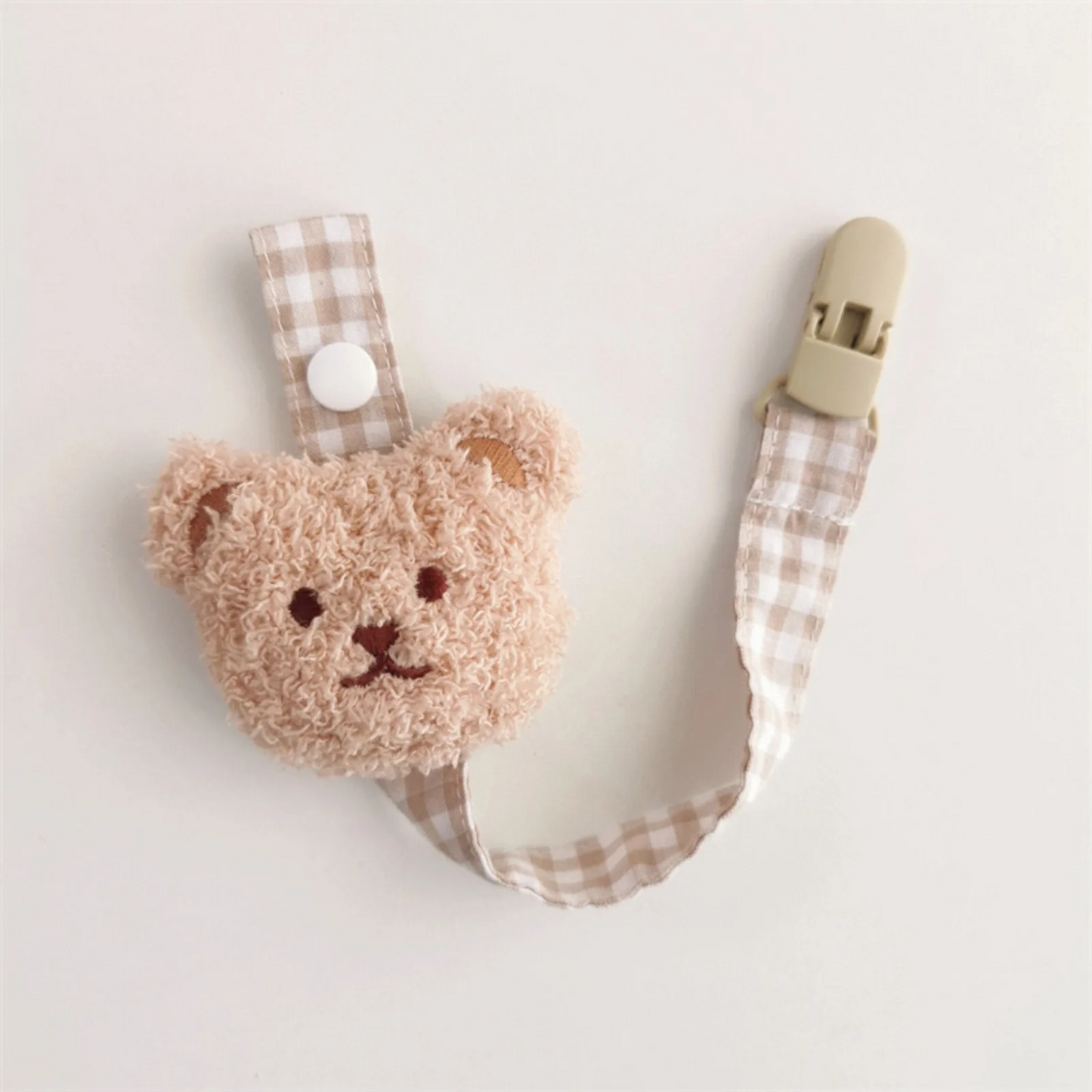 attache tétine beige