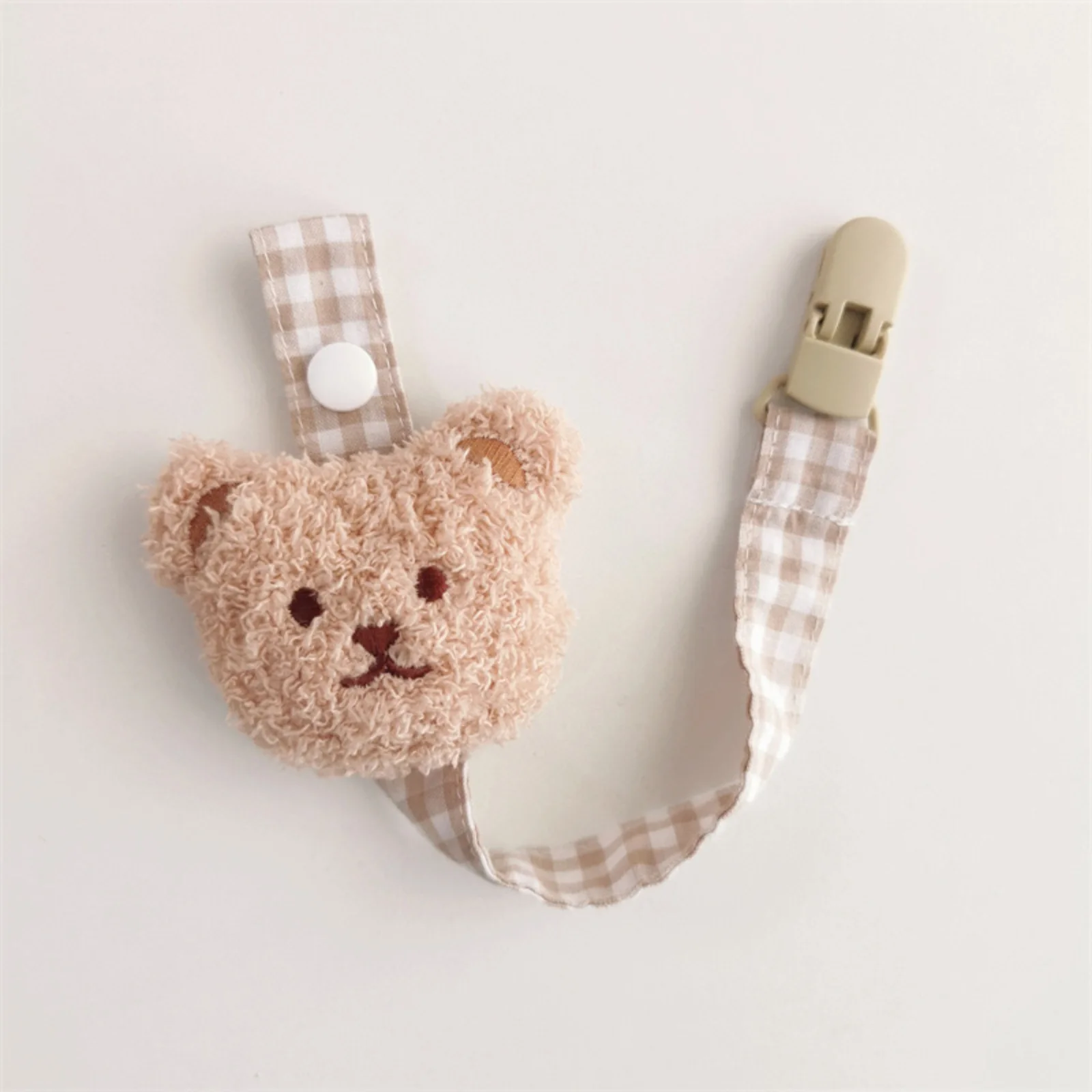 attache tétine beige